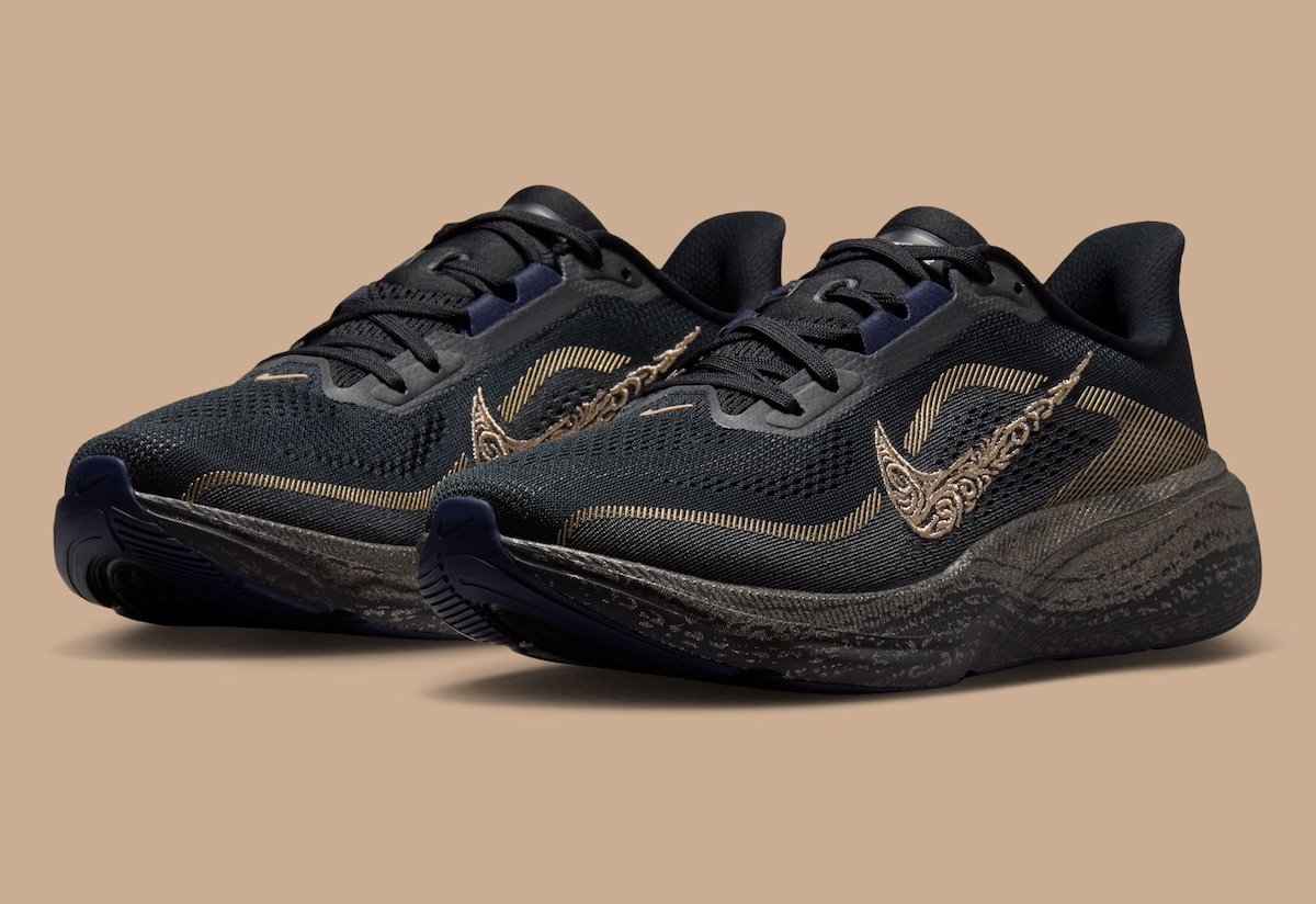 Nike Running Keely Hodgkinson four-shoe collection featuring Pegasus 42, Vomero Plus, ZoomX Vaporfly NEXT%, and Victory 2 in black and Midnight Blue with gold accents - detail view 2