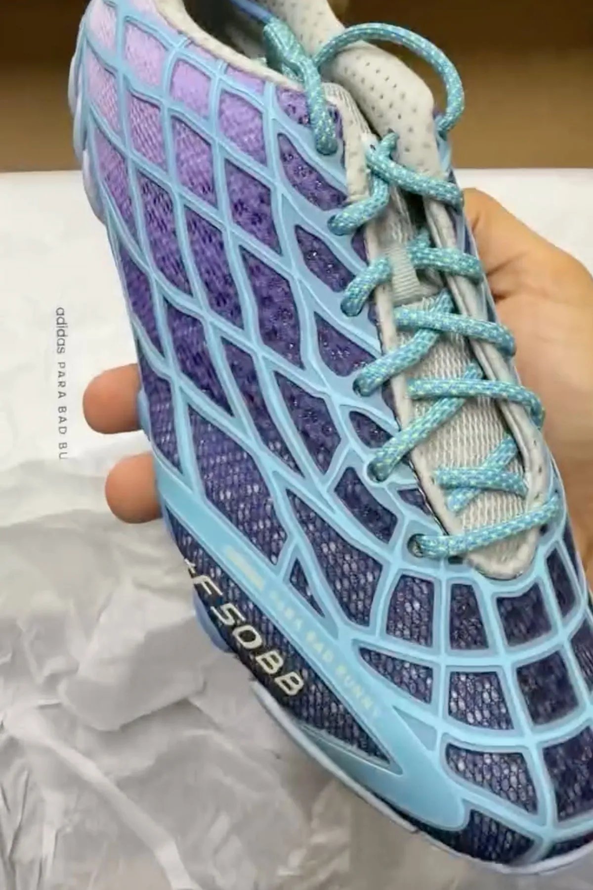 Bad Bunny x adidas F50 Ghost Sprint in purple and blue gradient colorway, showing F50 TPU skeletal upper paired with Ghost Sprint track outsole - detail view 3