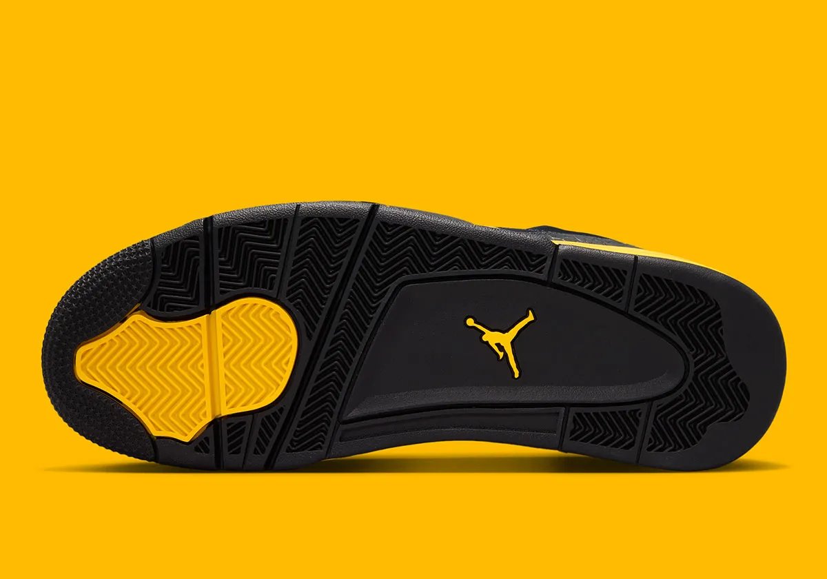 Jordan Son of Mars Low in Thunder colorway featuring black upper with Dark Smoke Grey elephant print and Tour Yellow sole accents - detail view 2