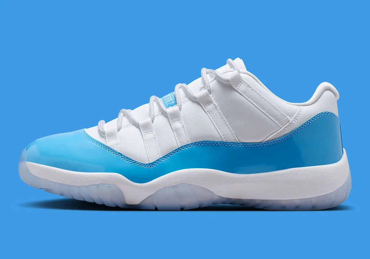 Air Jordan 11 Low in University Blue and white, showing mudguard detail and icy translucent sole - detail view 1