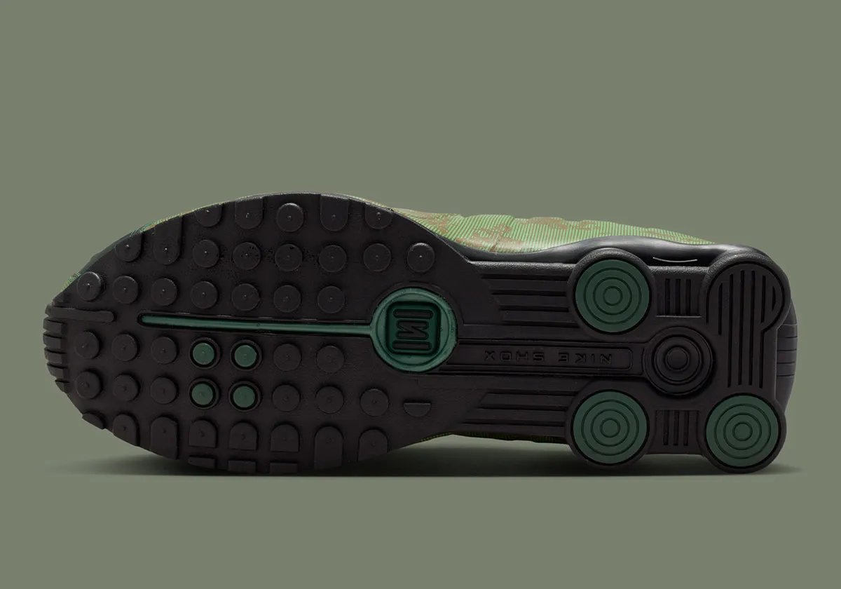 Nike Shox R4 in Team Kelly Green and Rough Green camo with all-black Shox cushioning unit and tactile mini Swoosh detail - detail view 2
