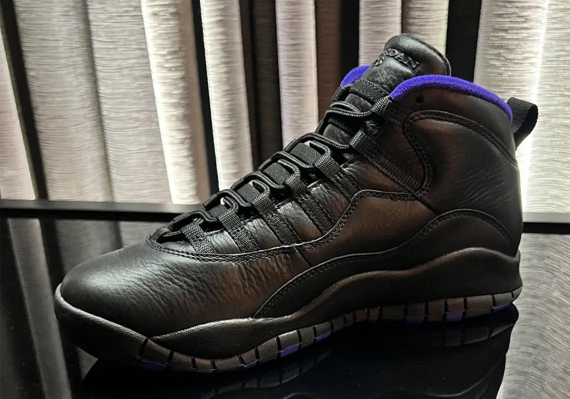 Air Jordan 10 OG Sacramento in black leather with dark concord purple accents, shown from multiple angles during 2026 release preview - detail view 3