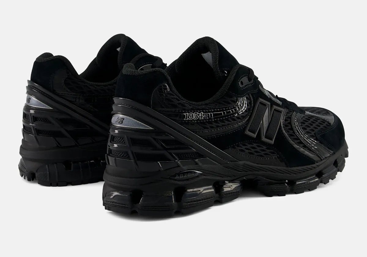 New Balance 1954R in Triple Black with glossy patent leather underlays - detail view 1