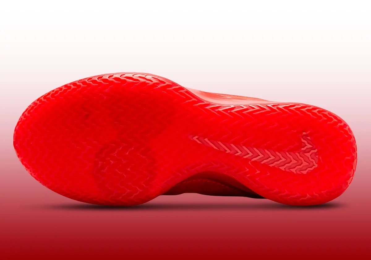 Nike Zoom LeBron NXXT Gen in Crimson Red colorway, front three-quarter view showing upper and midsole details - detail view 3