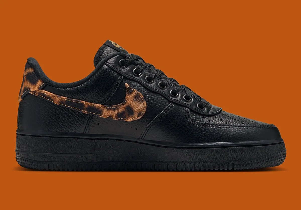 Nike Air Force 1 Low in black tumbled leather with leopard print detailing on the Swoosh and heel tab - detail view 2
