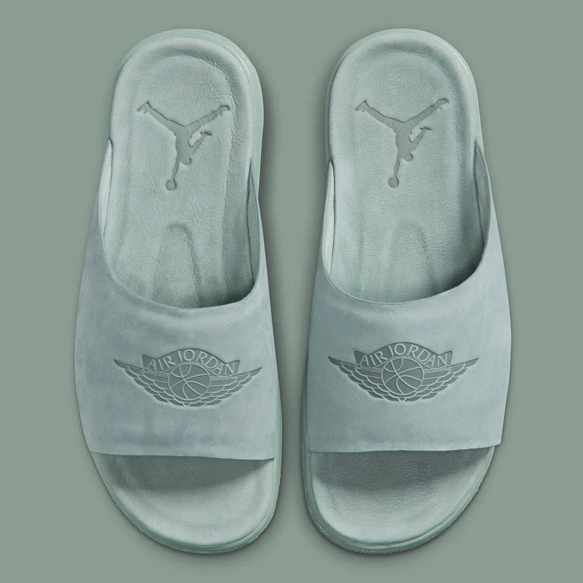 Jordan Modero 1 Slide in neutral colorway showing premium material construction and minimal branding - detail view 1