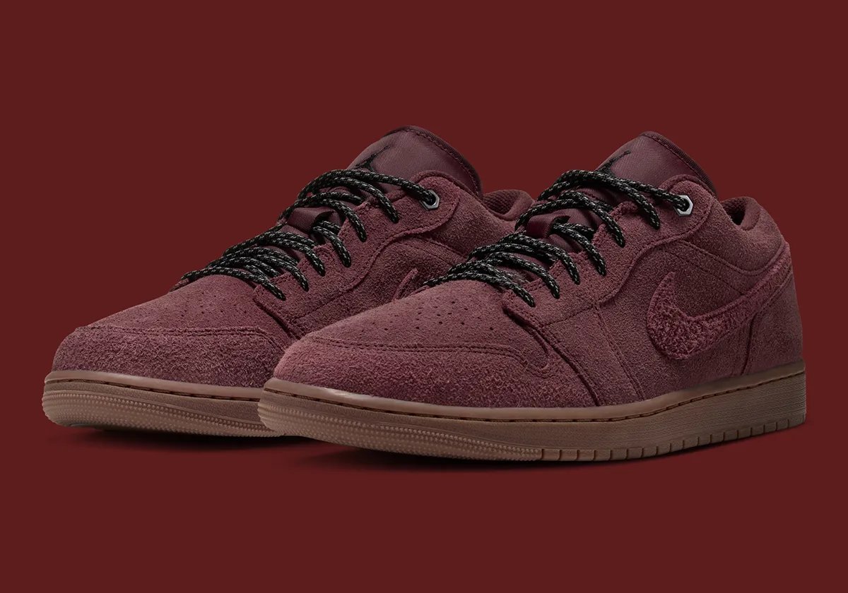 Nike Air Jordan 1 Low 'Dark Team Red' featuring shaggy suede, two-tone boot laces, and gum rubber sole in autumn colorway