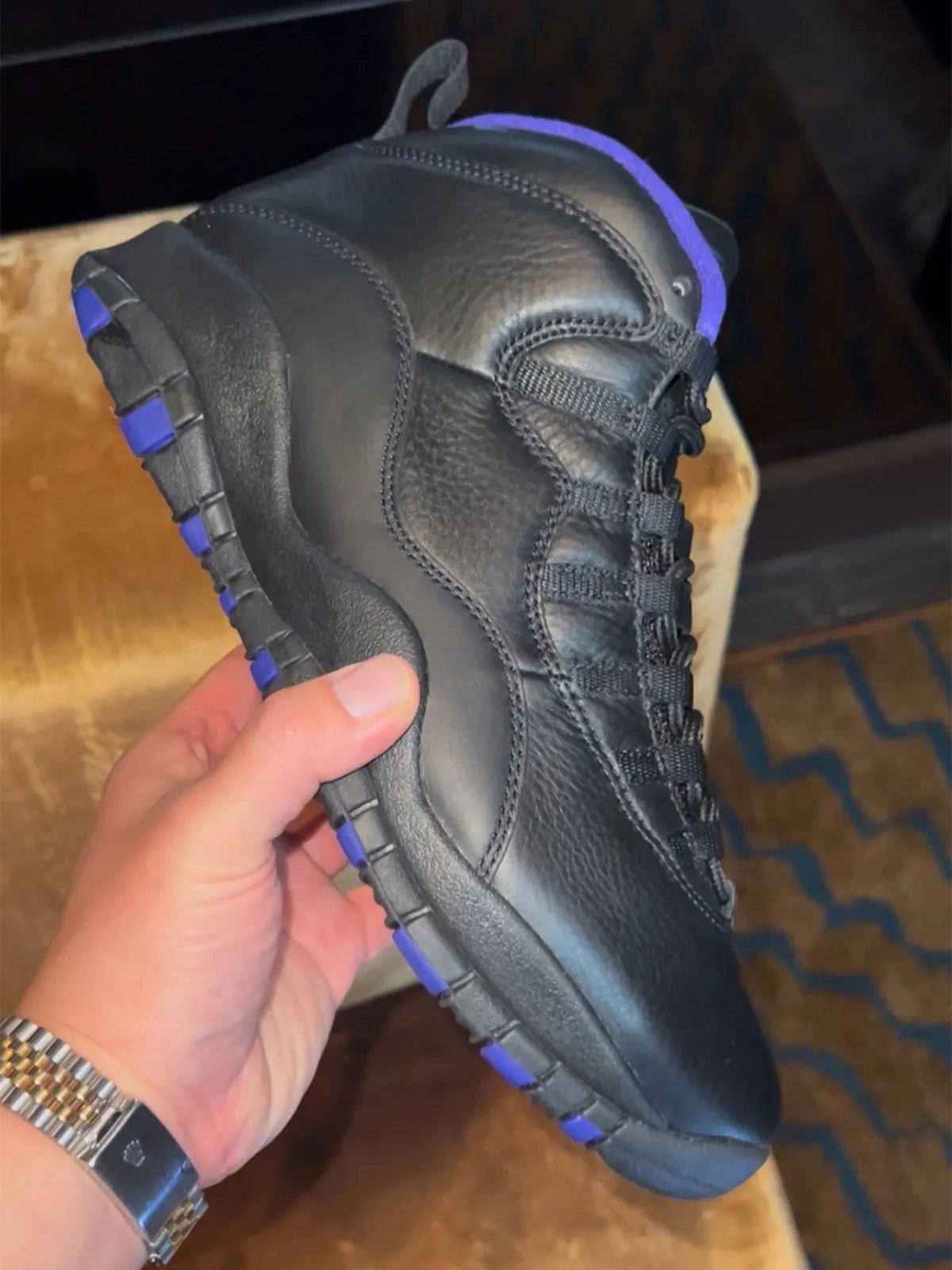 Air Jordan 4 Bred retro sneaker featuring black, grey, red, and white colorway from Jordan Brand's Holiday 2026 collection preview at New York Fashion Week - detail view 3