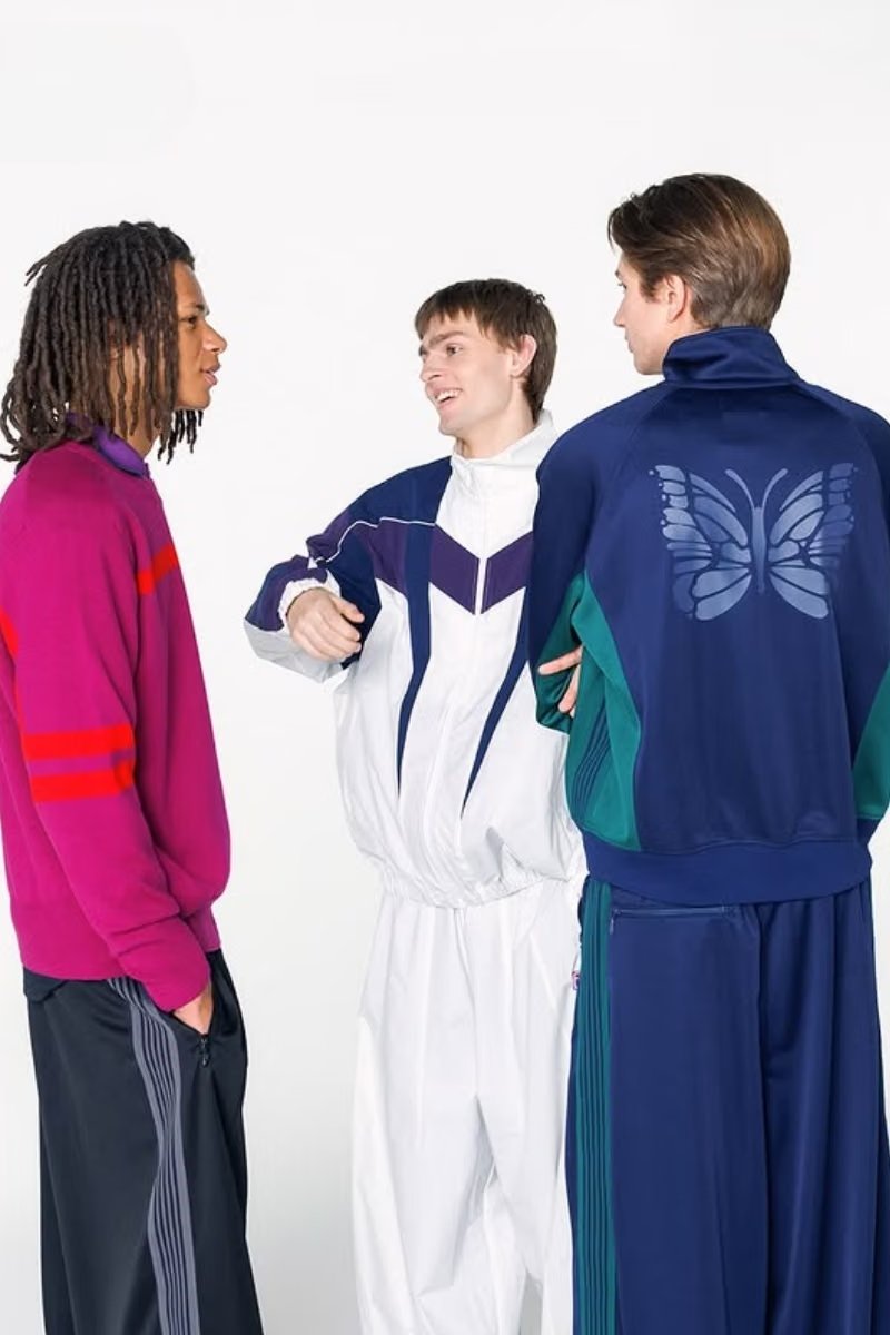 NEEDLES x FILA FW26 capsule featuring oversized windbreaker and track jacket in retro colorways - detail view 1