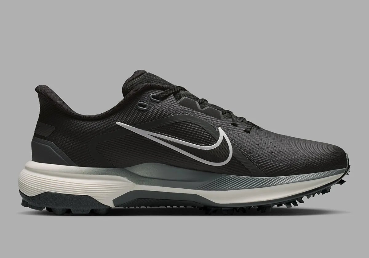 Nike Pegasus 1 Golf in black colorway, showing lateral support plates and hybrid traction system - detail view 3
