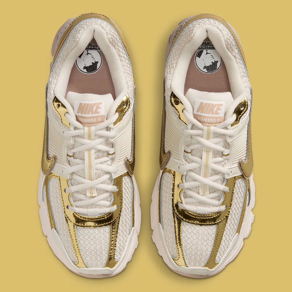 Nike Zoom Vomero 5 Metallic Gold colorway with rosy Swoosh detailing and metallic accents on upper - detail view 3