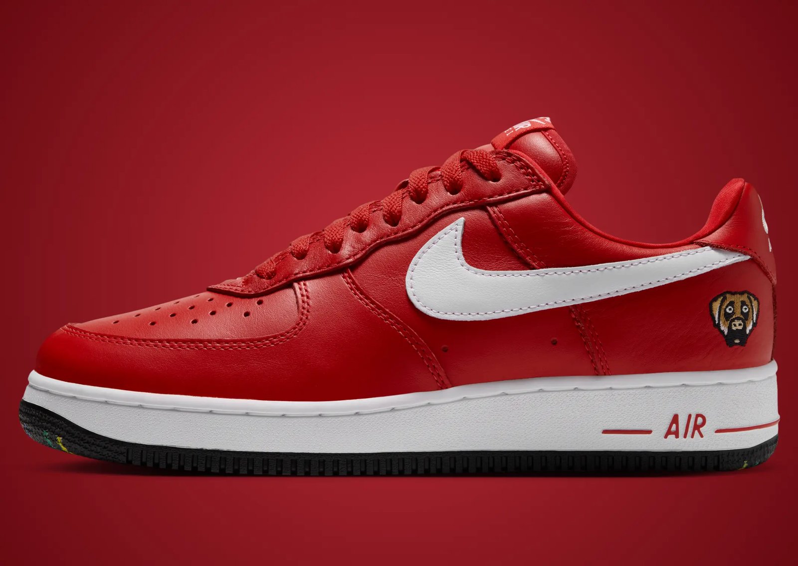 Victor Victor x Nike Air Force 1 Low '01 in Yellow and University Red, featuring monochrome plush leather with white Swoosh and custom dog head logo on lateral heel - detail view 4