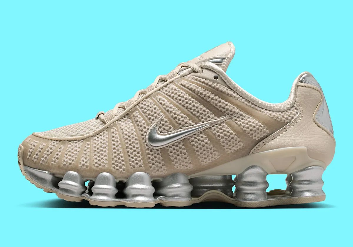 Nike Shox TL in cream base color with metallic silver accents and reflective detailing - detail view 1