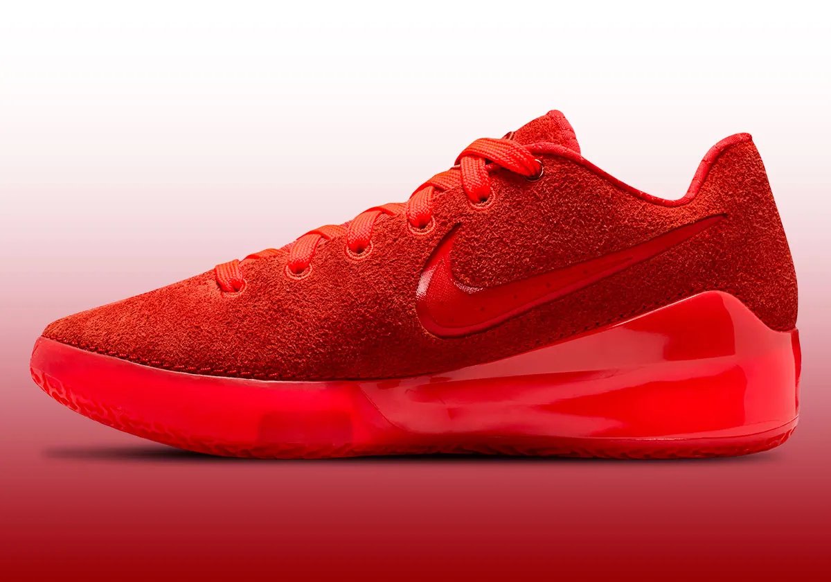 Nike Zoom LeBron NXXT Gen in Crimson Red colorway, front three-quarter view showing upper and midsole details - detail view 1