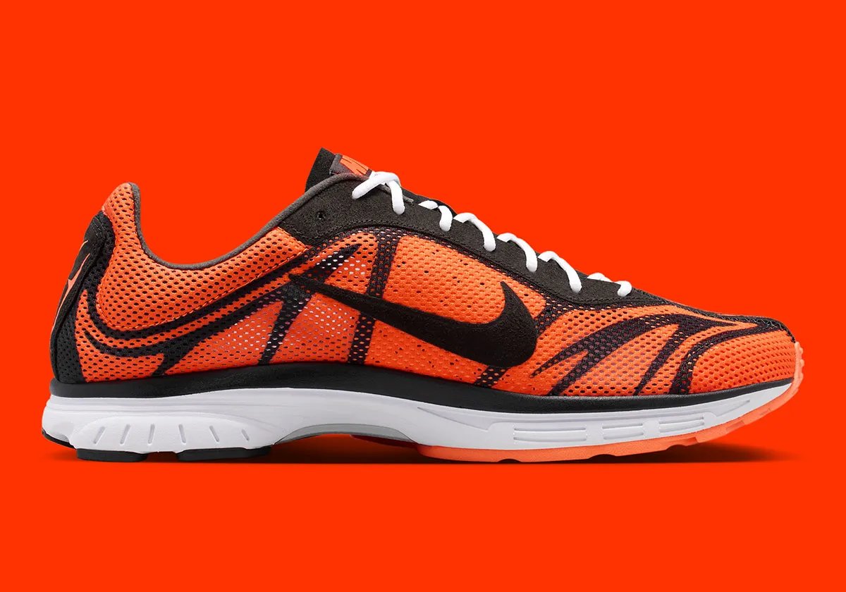 Nike Zoom Streak 3 in Safety Orange colorway with black stripes and white accents on laces and sole - detail view 2