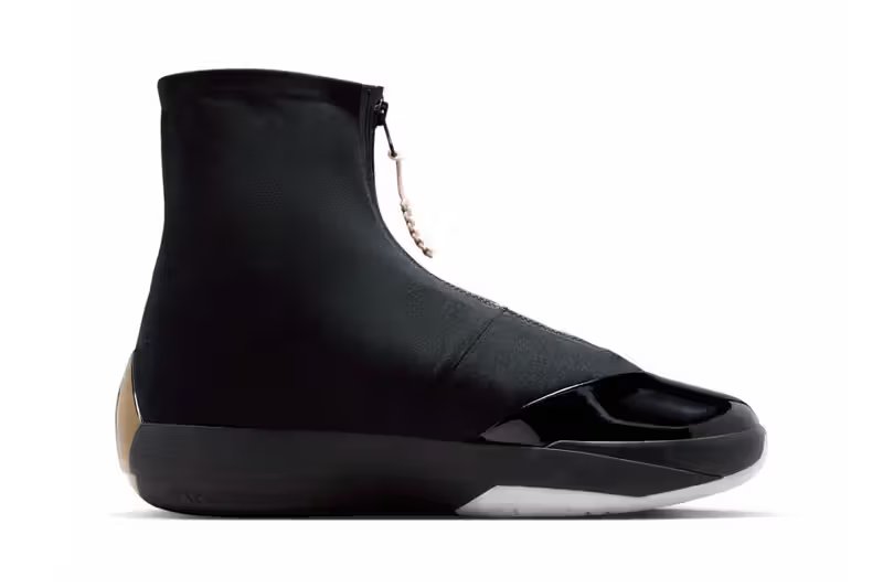 Air Jordan 4028 in Black with metallic gold and pearl white detailing, shown from lateral side profile - detail view 3
