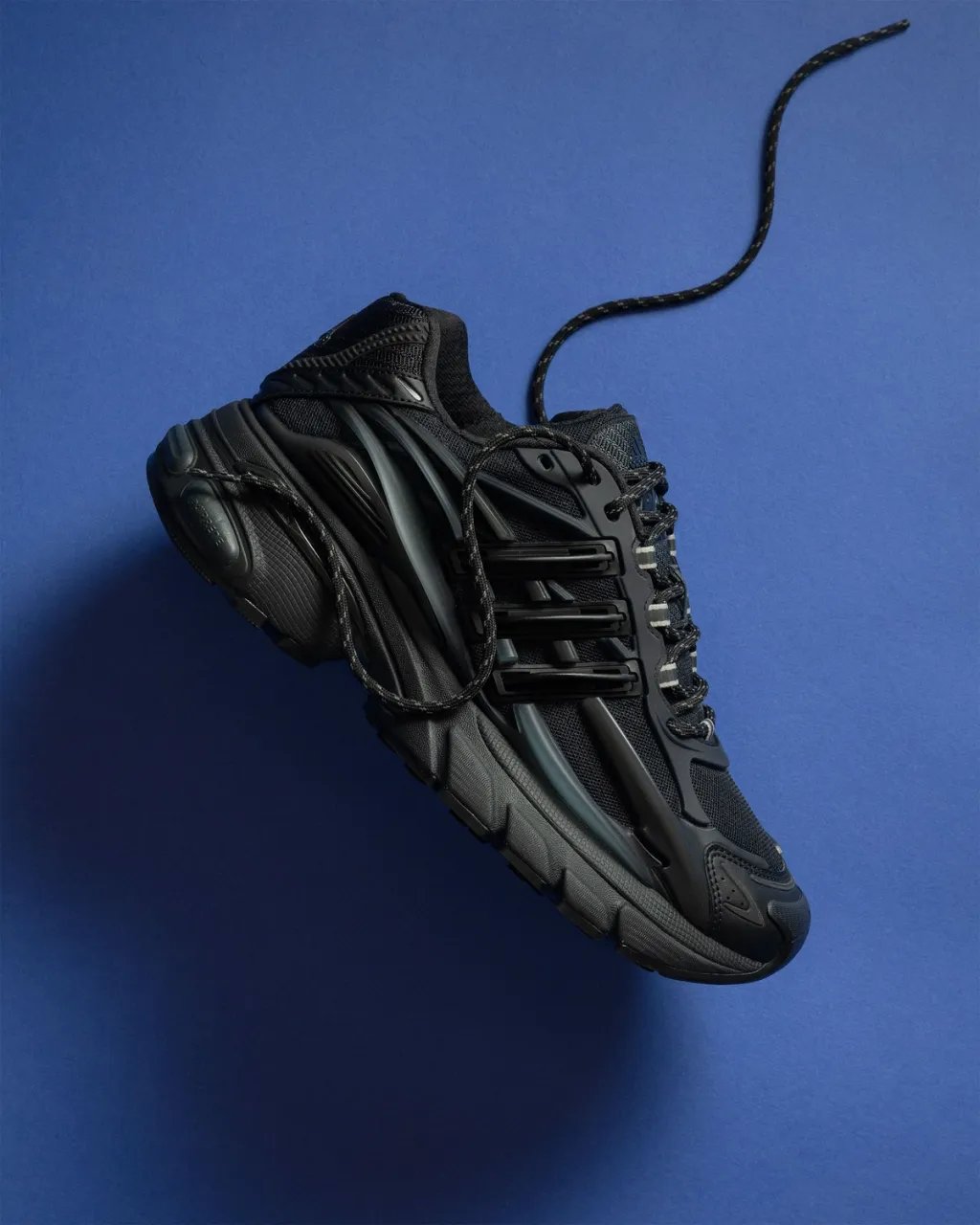 Pharrell Williams' Adidas Adistar Jellyfish in Triple Black colorway, shown from the side profile