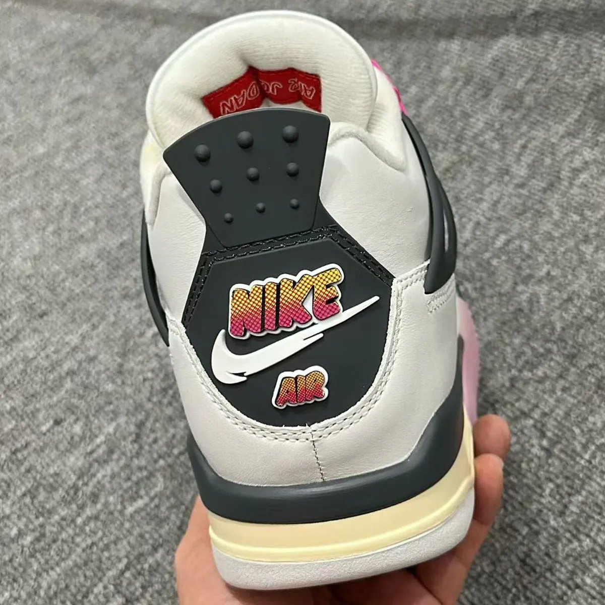 Air Jordan 4 'Comic' featuring Fire Pink text bubble eyestay and comic book-inspired bubble lettering on Off White leather upper - detail view 2