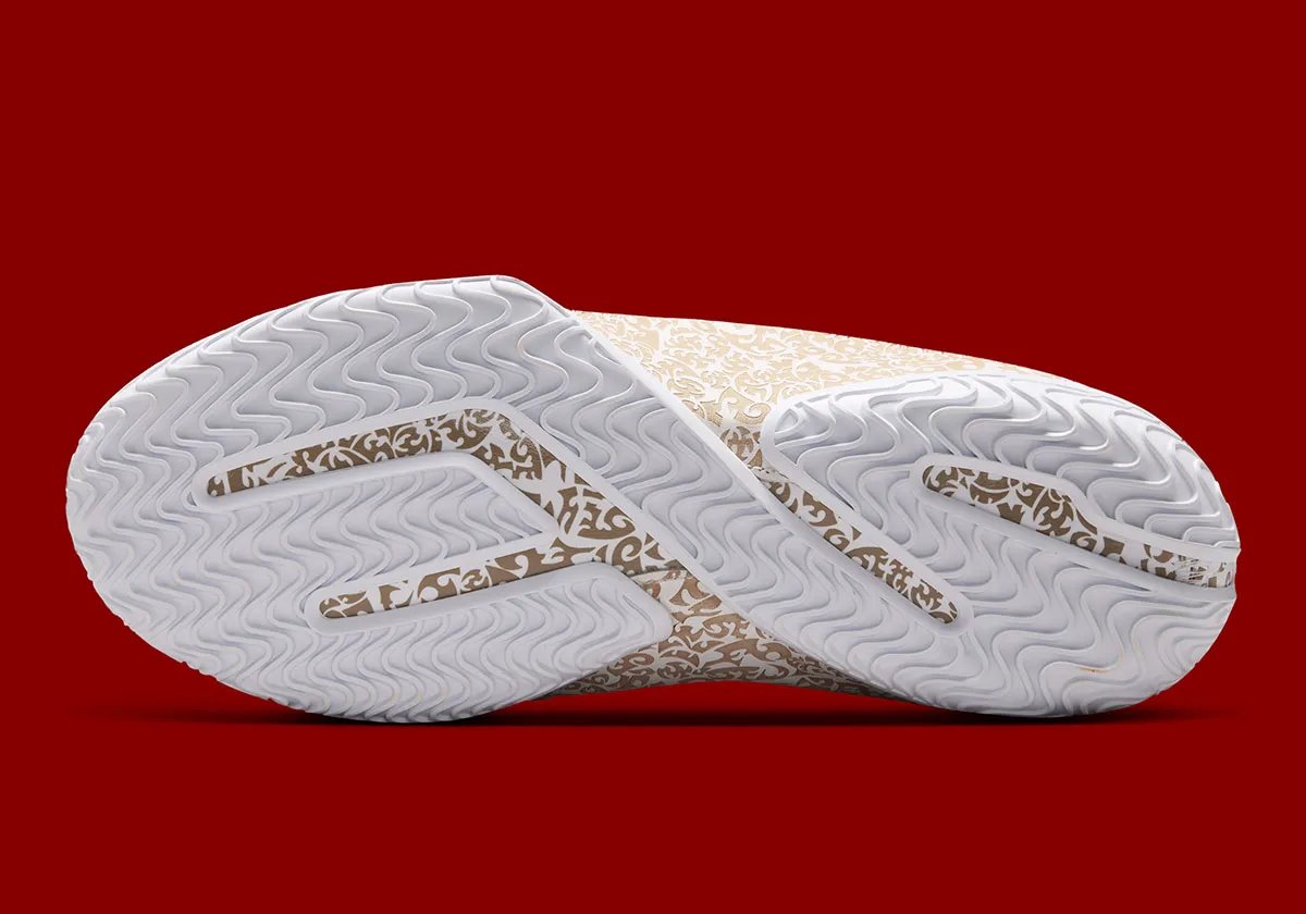 Nike LeBron 23 'Laser' colorway with white upper, laser-etched crown shell, and red satin interior lining - detail view 2