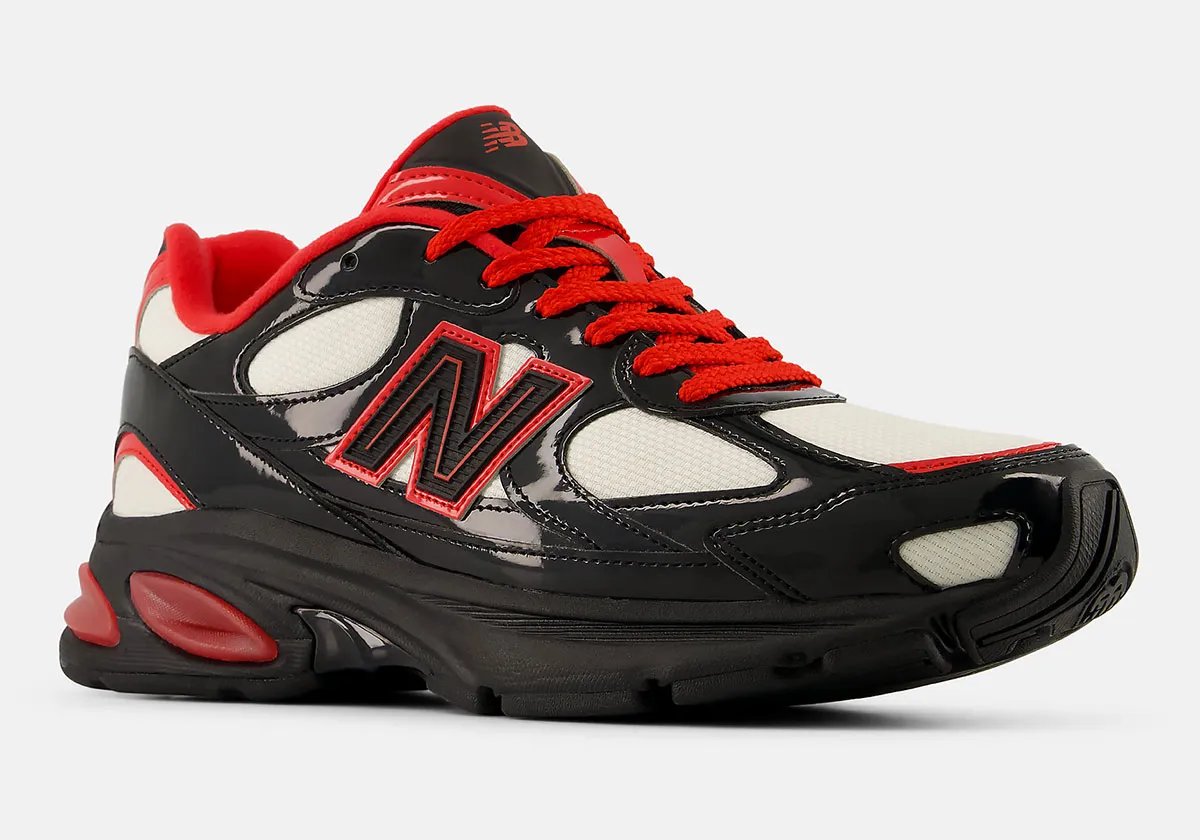 New Balance 2010 Firecracker colorway featuring off-white mesh, jet black patent leather, and fire red accents