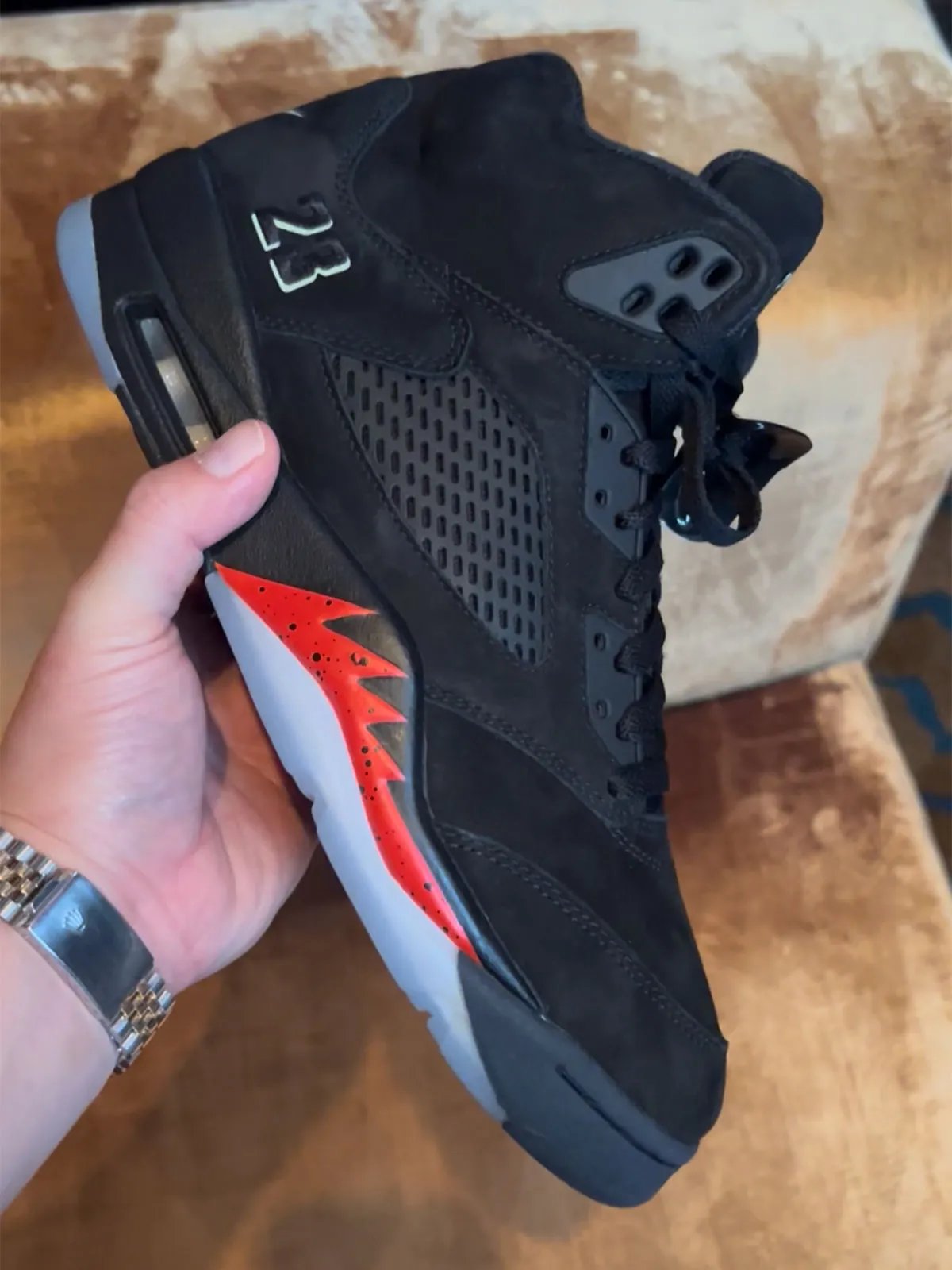 Air Jordan 4 Bred retro sneaker featuring black, grey, red, and white colorway from Jordan Brand's Holiday 2026 collection preview at New York Fashion Week - detail view 4