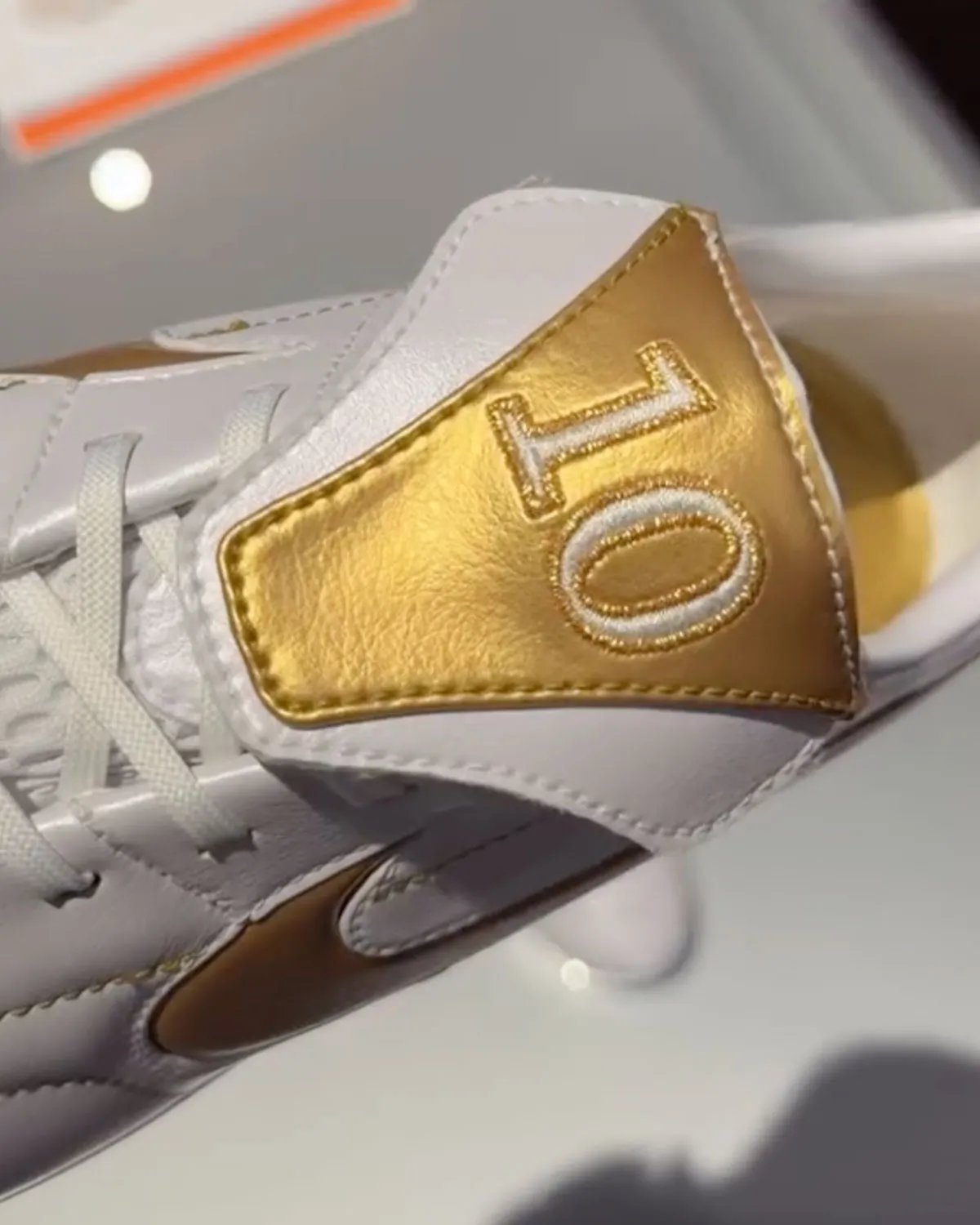 Nike Cryoshot Tiempo Legend in Touch of Gold colorway with gilded accents and quilted upper - detail view 3