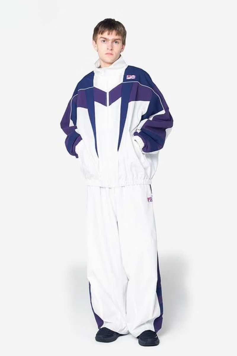 NEEDLES x FILA FW26 capsule featuring oversized windbreaker and track jacket in retro colorways - detail view 3