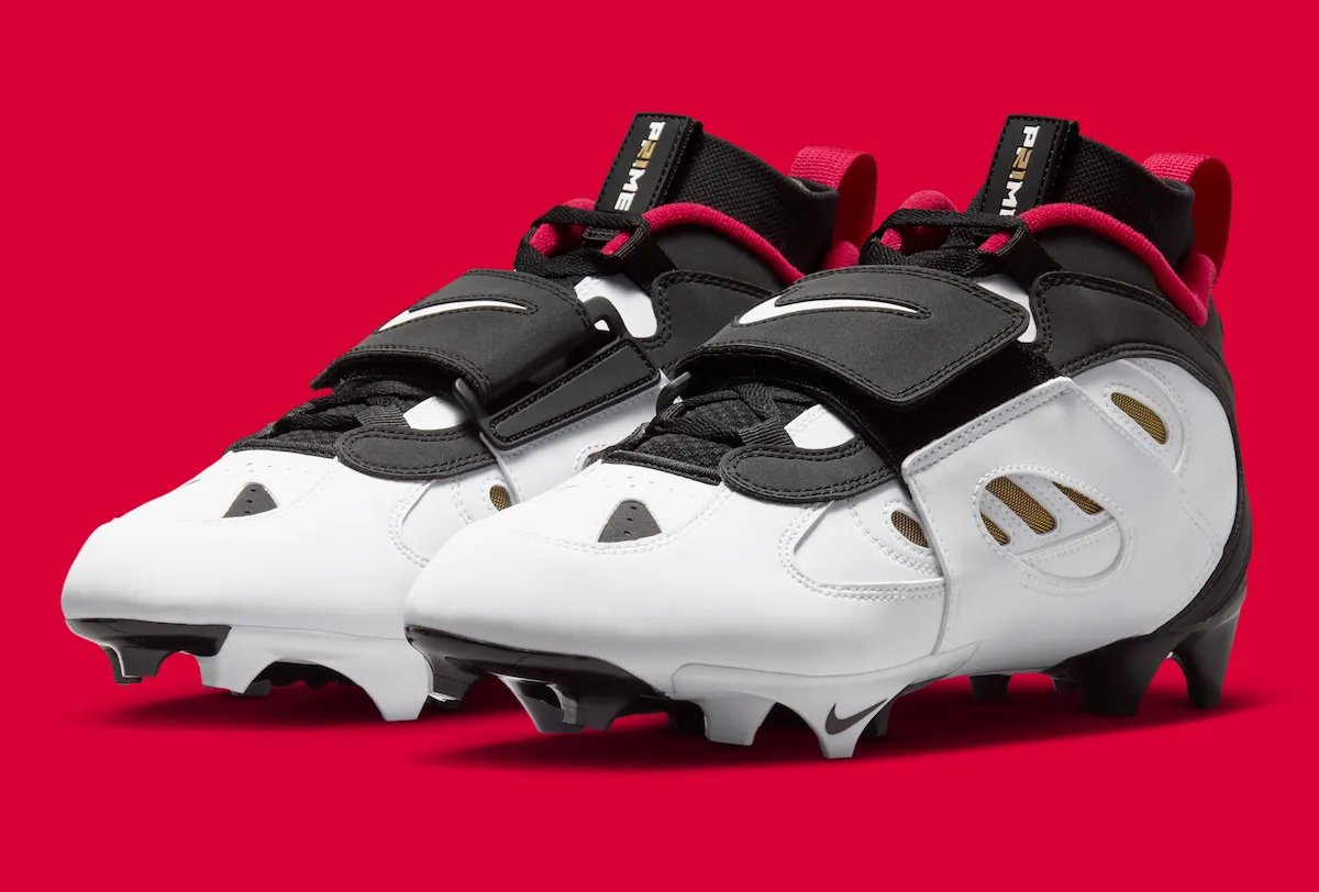 Nike Diamond Turf 2 49ers football cleat in black with prime red and metallic gold accents, Deion Sanders signature line - detail view 2