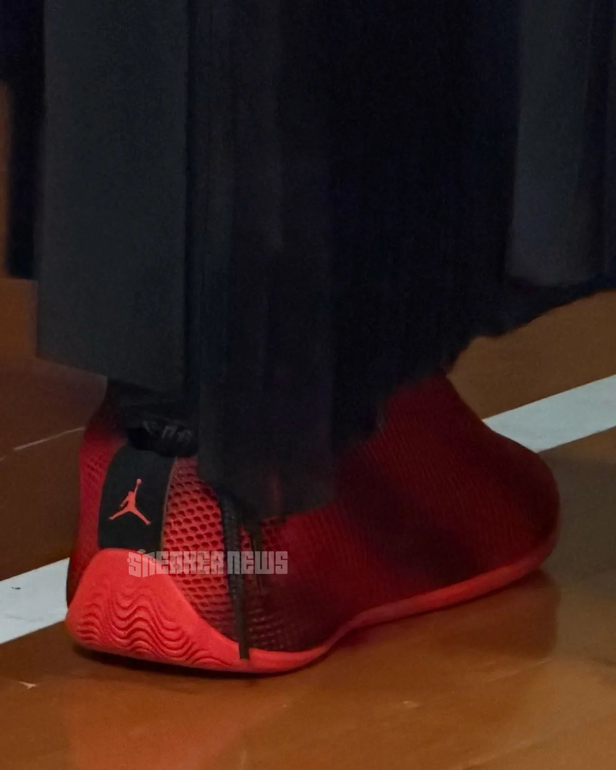 Jordan Vail lifestyle sneaker in red and black, showcasing mesh upper and unconventional rear-wrapping lace system - detail view 2