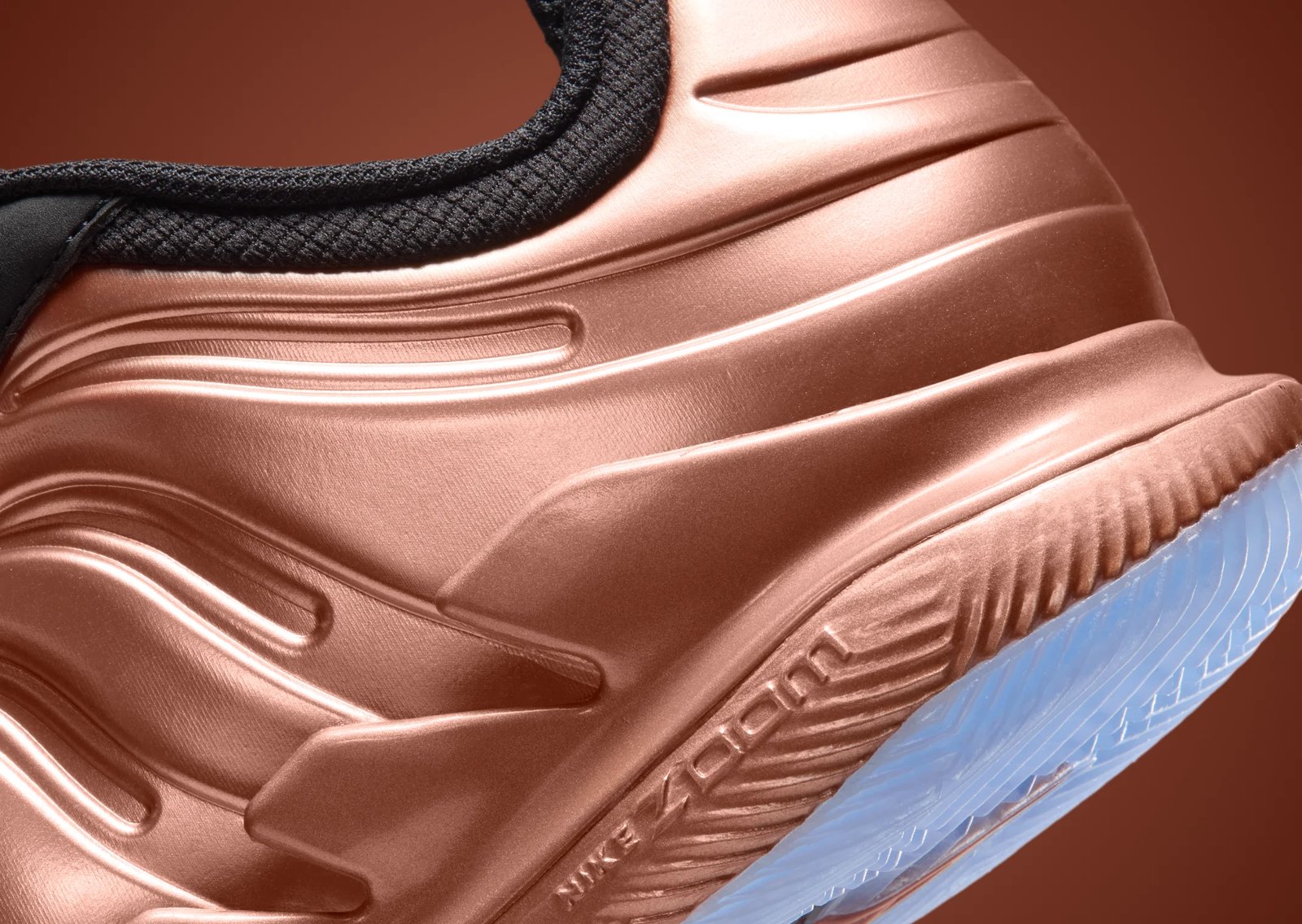 Nike Zoom Vapor X Posite in Copper colorway featuring Foamposite-inspired panels and icy blue outsole - detail view 2