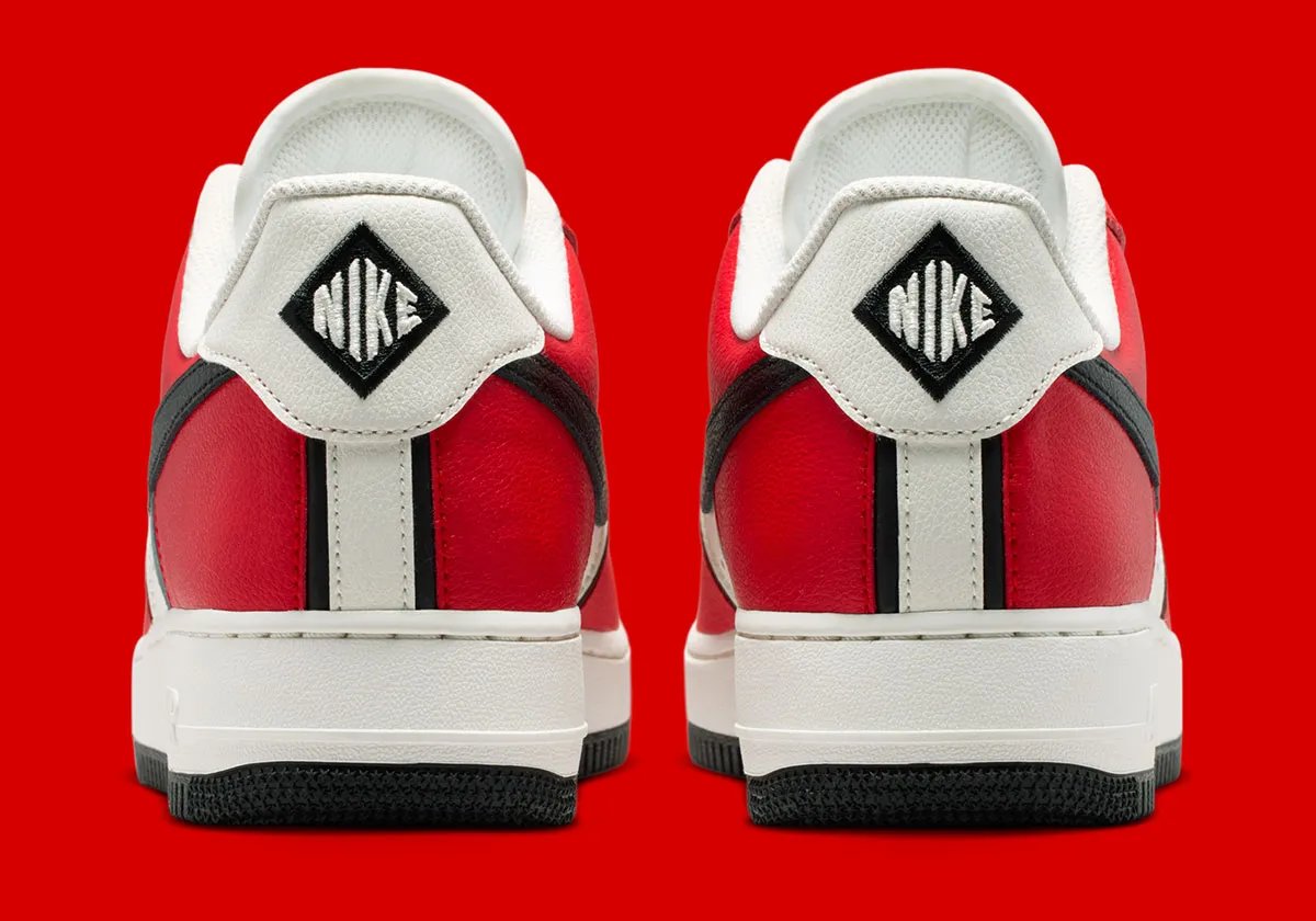 Nike Air Force 1 Low in University Red and black with diamond heel branding and Sail quarter panel - detail view 5