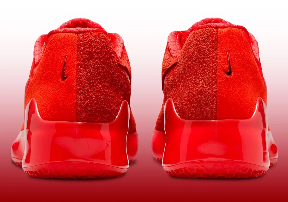 Nike Zoom LeBron NXXT Gen in Crimson Red colorway, front three-quarter view showing upper and midsole details - detail view 2