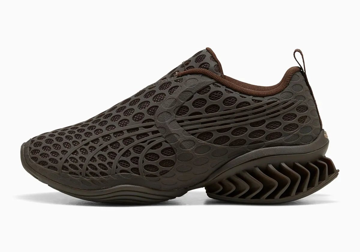 PUMA x _J.L-A.L_ Cell GEO-1 with geometric pocked cutouts across upper, lateral cage, and tongue in rich brown colorway - detail view 1