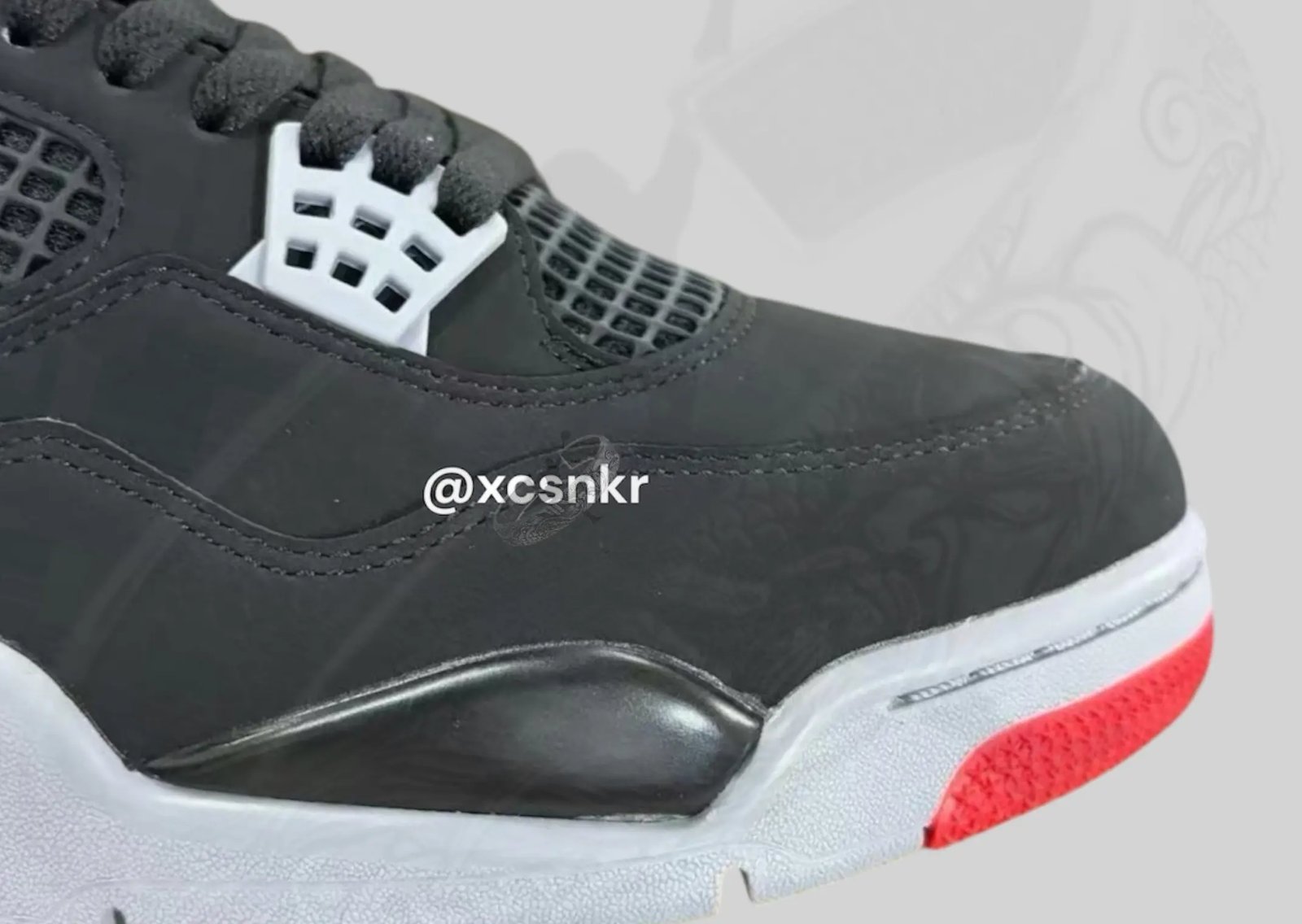 Air Jordan 4 Retro Bred in black nubuck with grey lace wings and red accents, OG 1989 colorway recreation - detail view 3
