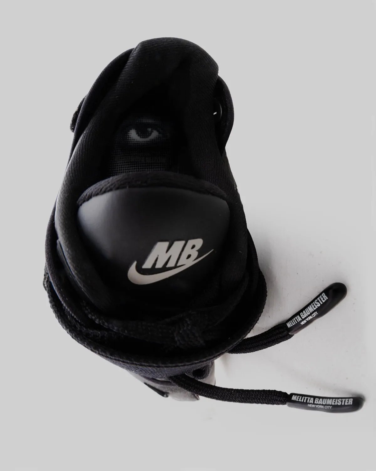 Melitta Baumeister x Nike Rift Rocker in Black/Black/White, featuring oversized waffle sole and optical graphics - detail view 3