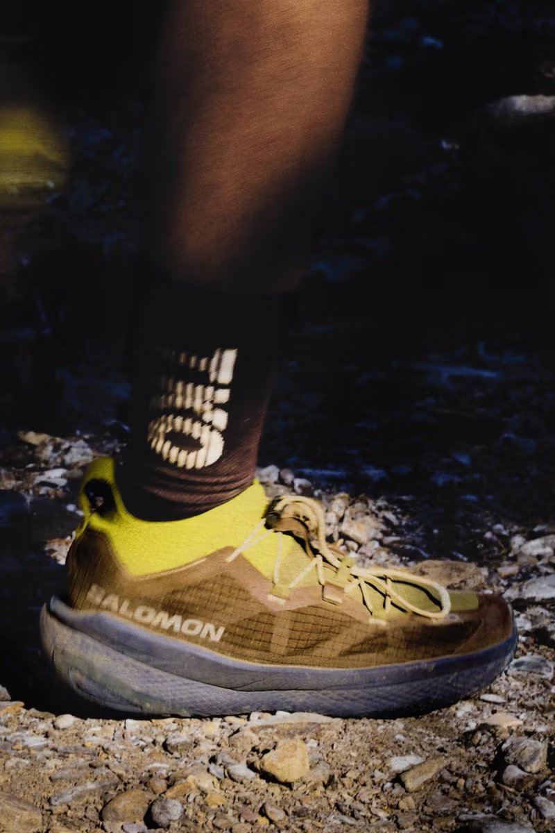 Salomon x Pas Normal Studios GRVL Concept hybrid training shoe with PEBA supercritical foam midsole and carbon blade construction, displayed with RACE SKIN 2 running vest from the T.K.O. SS26 collection - detail view 2