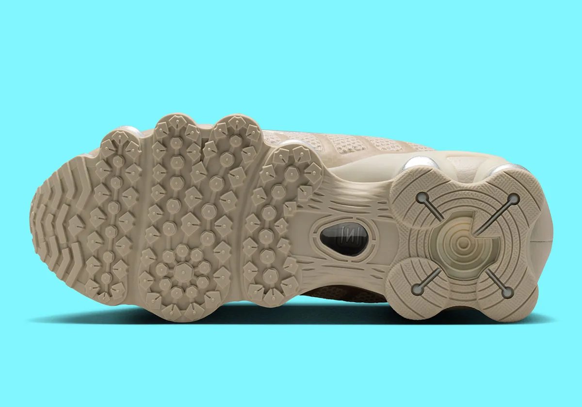 Nike Shox TL in cream base color with metallic silver accents and reflective detailing - detail view 2