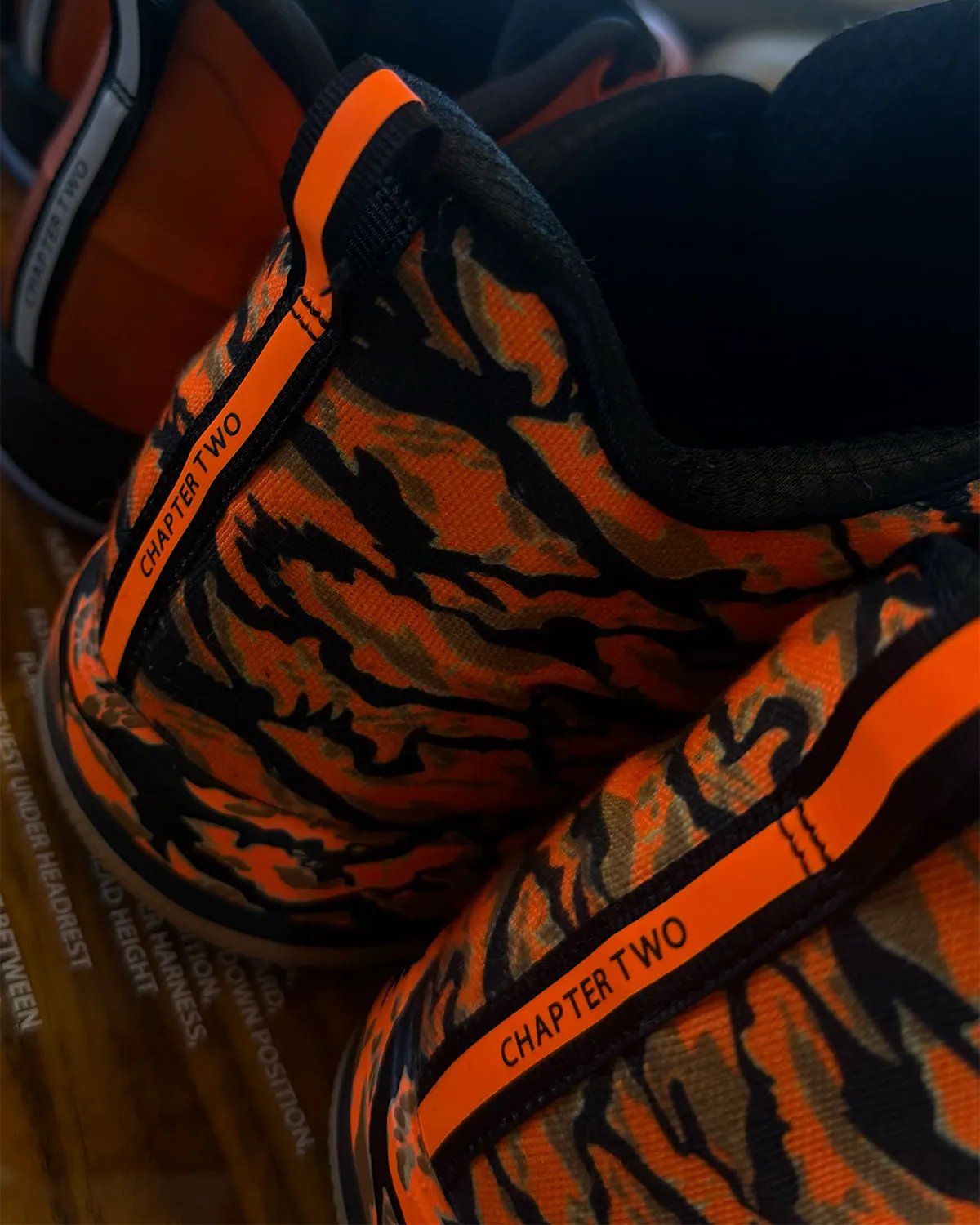Nike Book 2 in Foamposite-inspired orange molded upper with black accents and translucent outsole - detail view 1