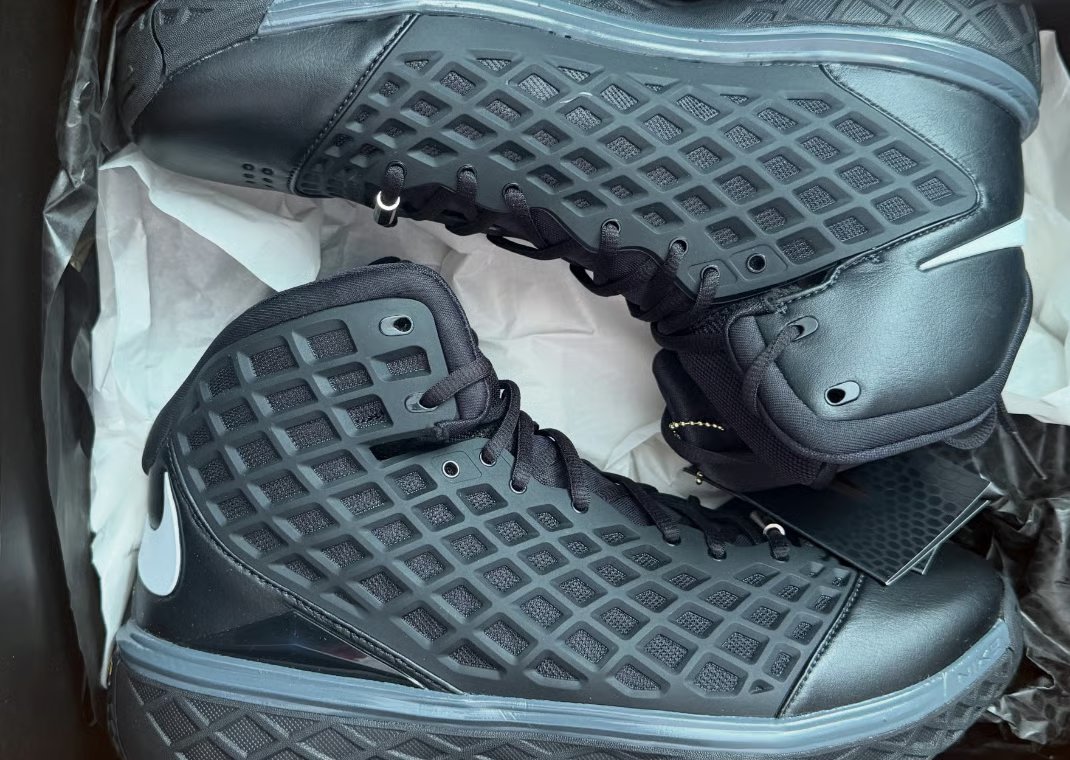 Nike Kobe 3 Protro Orca in black leather with white Swoosh branding and mesh side panels - detail view 2