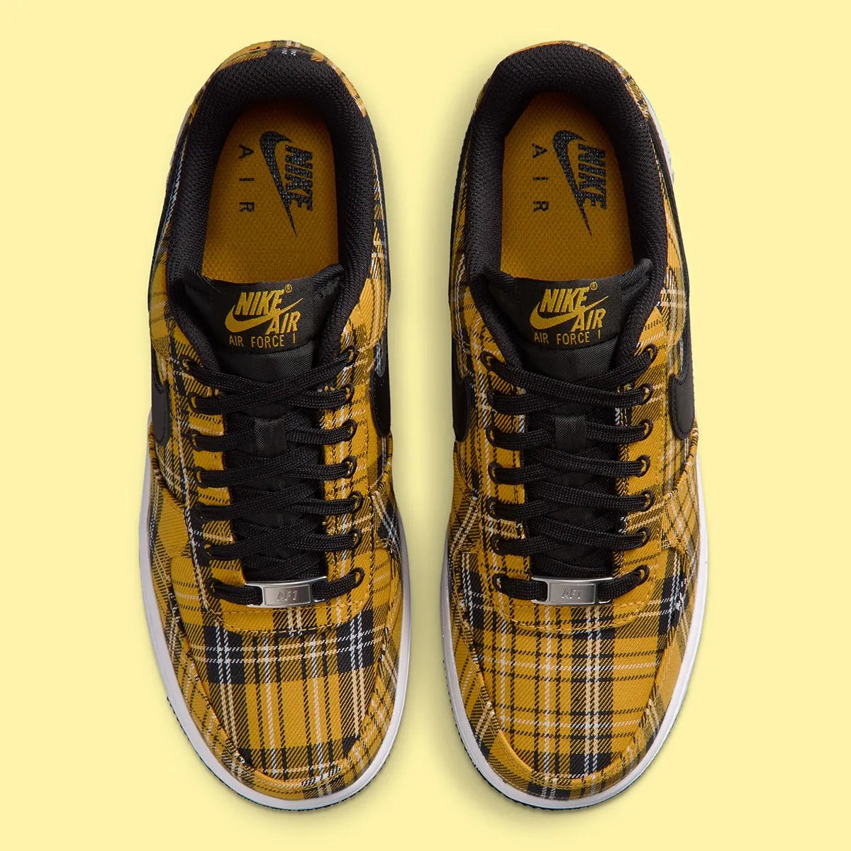 Nike Air Force 1 Low in yellow plaid with white upper and black trim, front three-quarter view - detail view 3