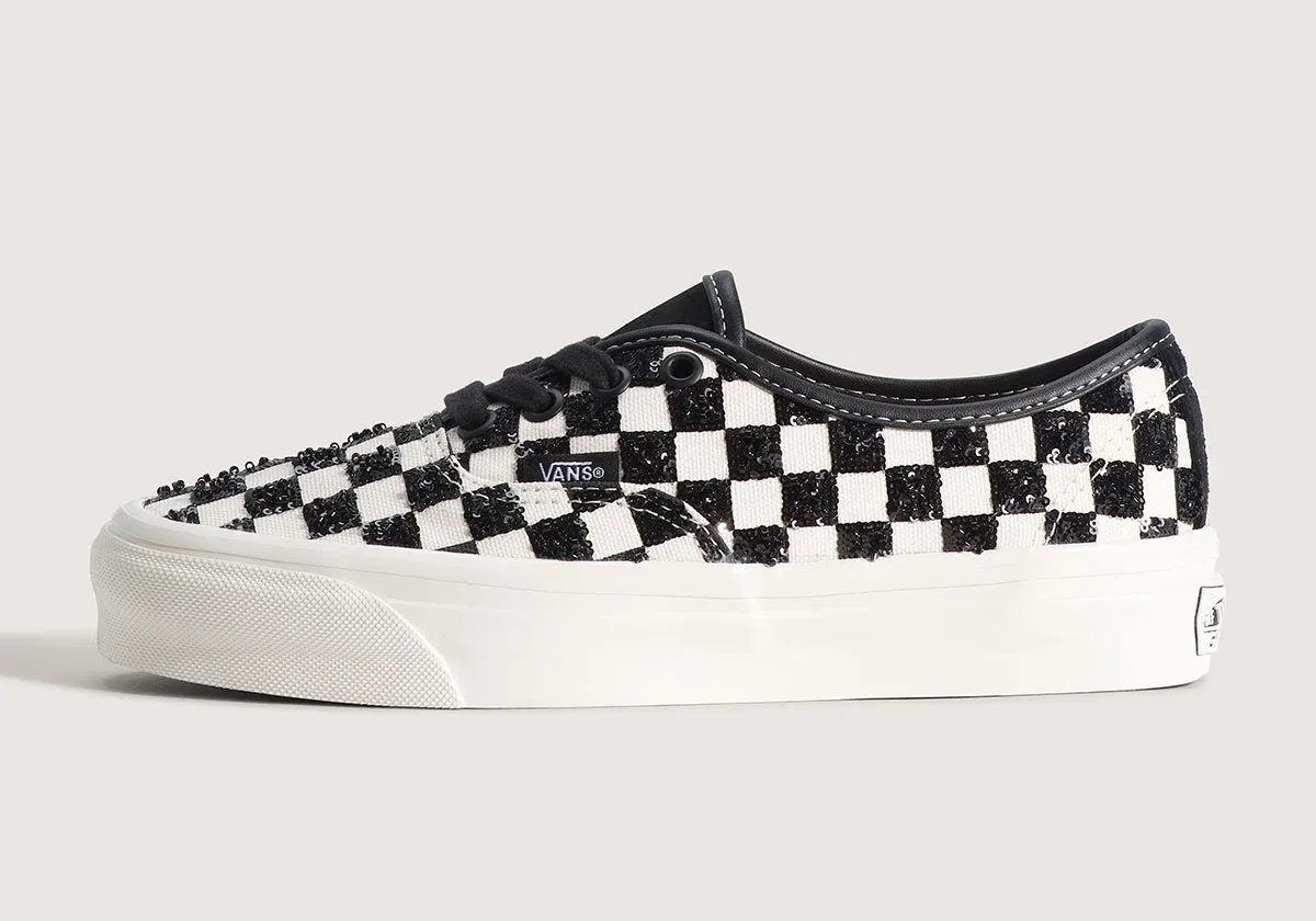 Vans Authentic LX in black checkerboard with sequin embellishment, side view of classic low-top silhouette - detail view 1