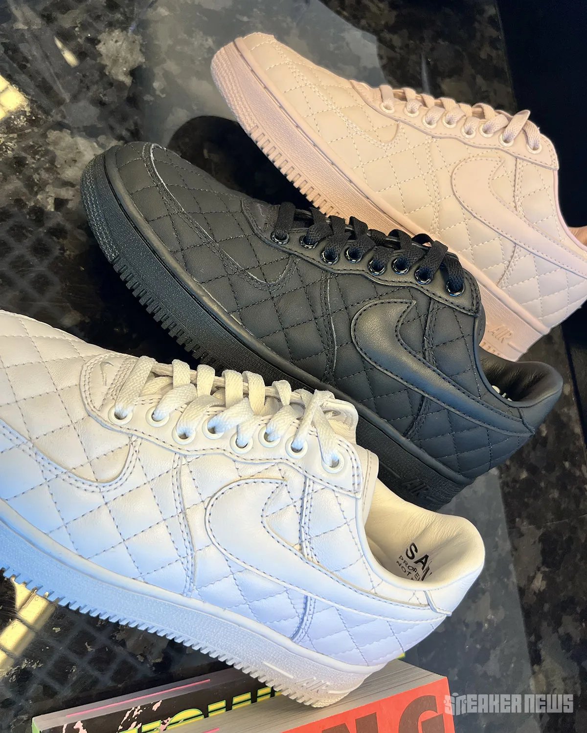 Nike Air Force 1 Low Quilted in triple white, featuring crosstitch detailing across the upper and matte leather collar - detail view 3
