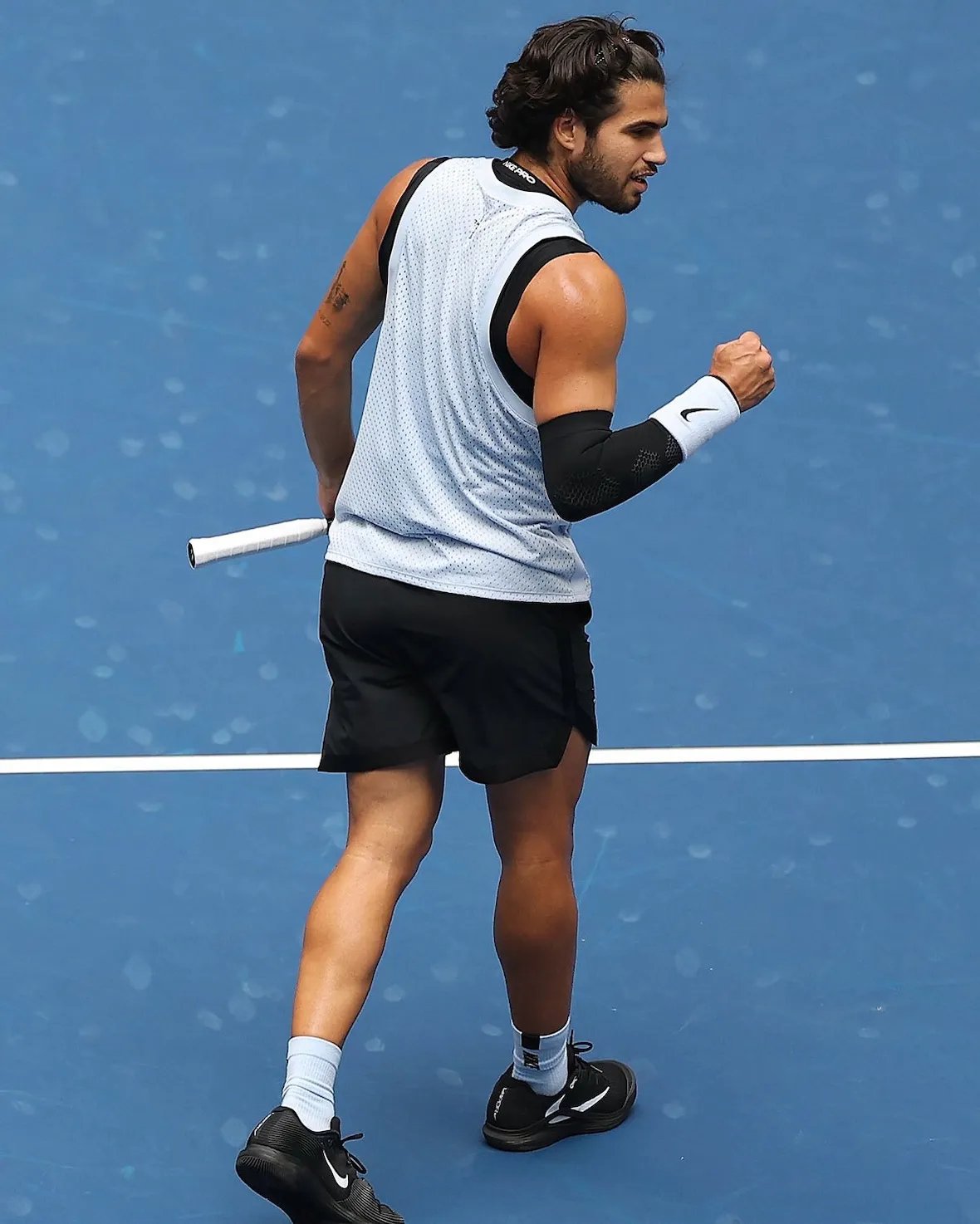 Carlos Alcaraz wearing black Travis Scott x Nike Zoom Vapor 12 with white Reverse Swoosh detail - detail view 3