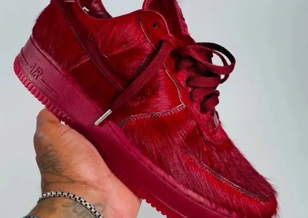 Nike Air Force 1 Low in Team Red pony hair with full upper and sole coverage, Holiday 2026 - detail view 1
