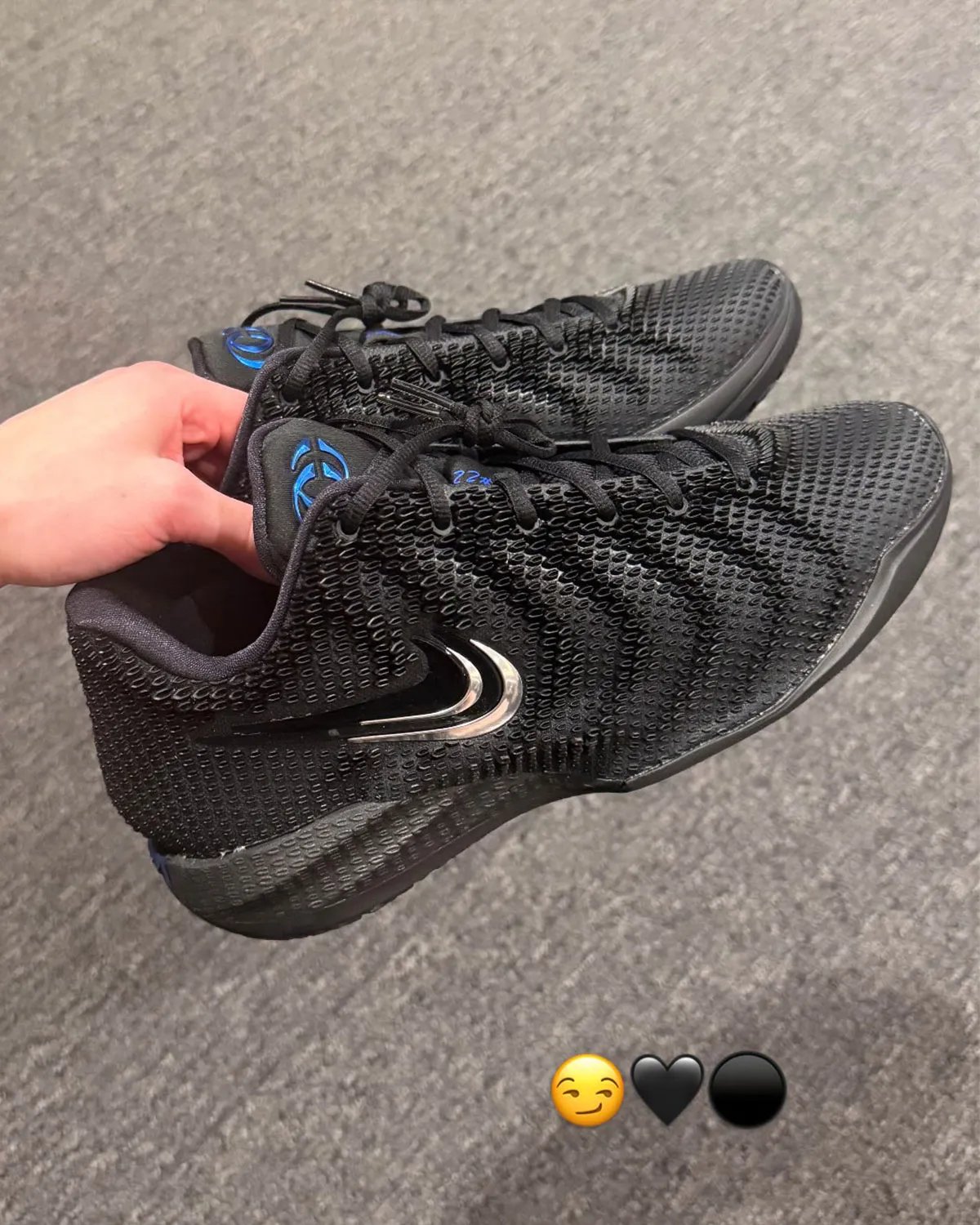 Nike Caitlin 1 "3x Black" colorway featuring black upper with metallic silver and Caitlin Blue accents - detail view 2