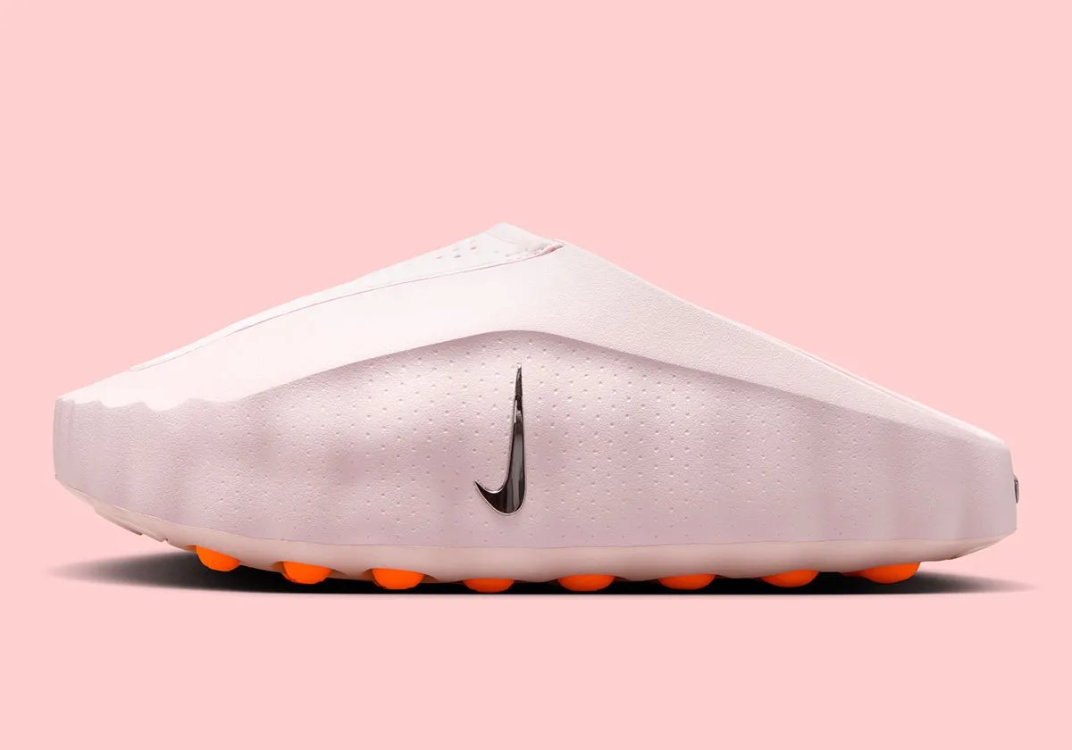 Nike Mind 001 in Pearl Pink, a soft iridescent slide with molded footbed and refined strap design - detail view 1
