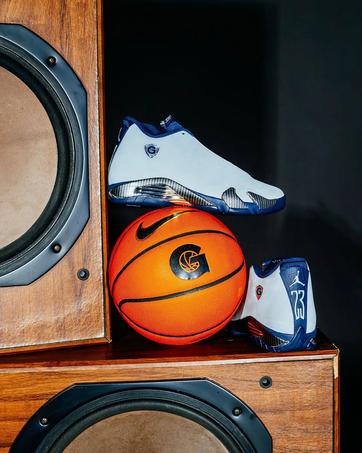 Air Jordan 14 PE in light grey nubuck with navy accents and carbon fiber midsole, Georgetown G logo on lateral shield - detail view 1