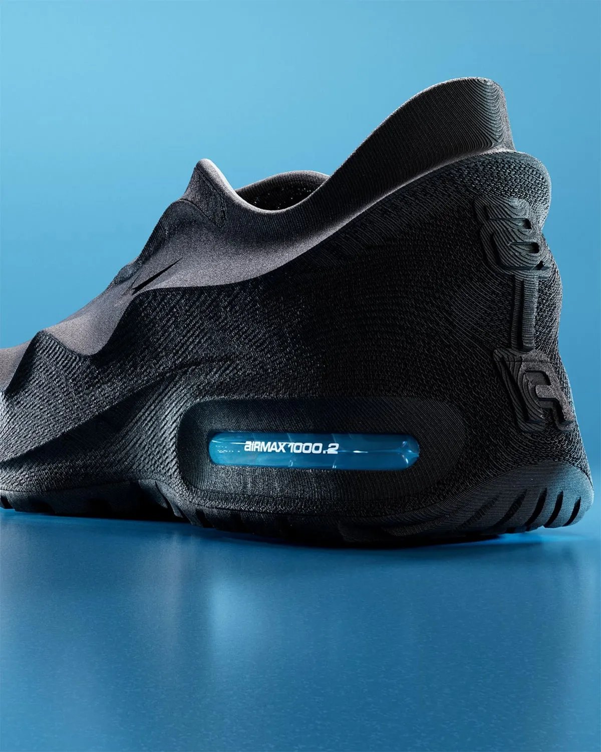 Nike Air Max 1000.2 Glacier Blue sneaker featuring 3D-printed upper and translucent Glacier Blue heel Air unit - detail view 1