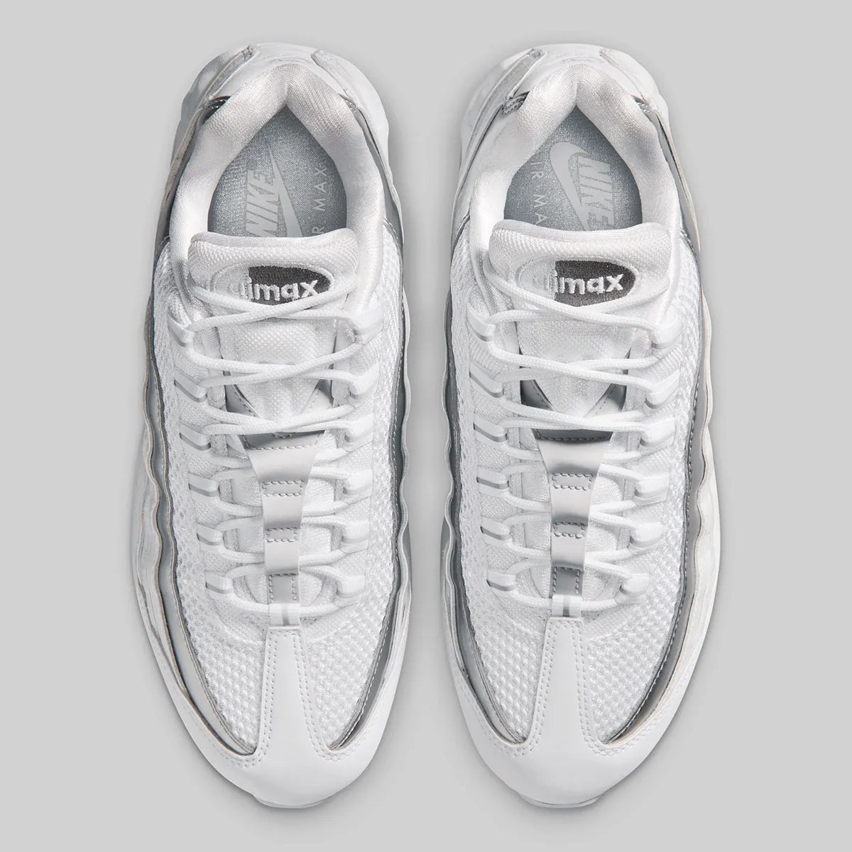 Nike Air Max 95 in pure white with metallic silver accents on mudguard and visible Air Unit - detail view 4