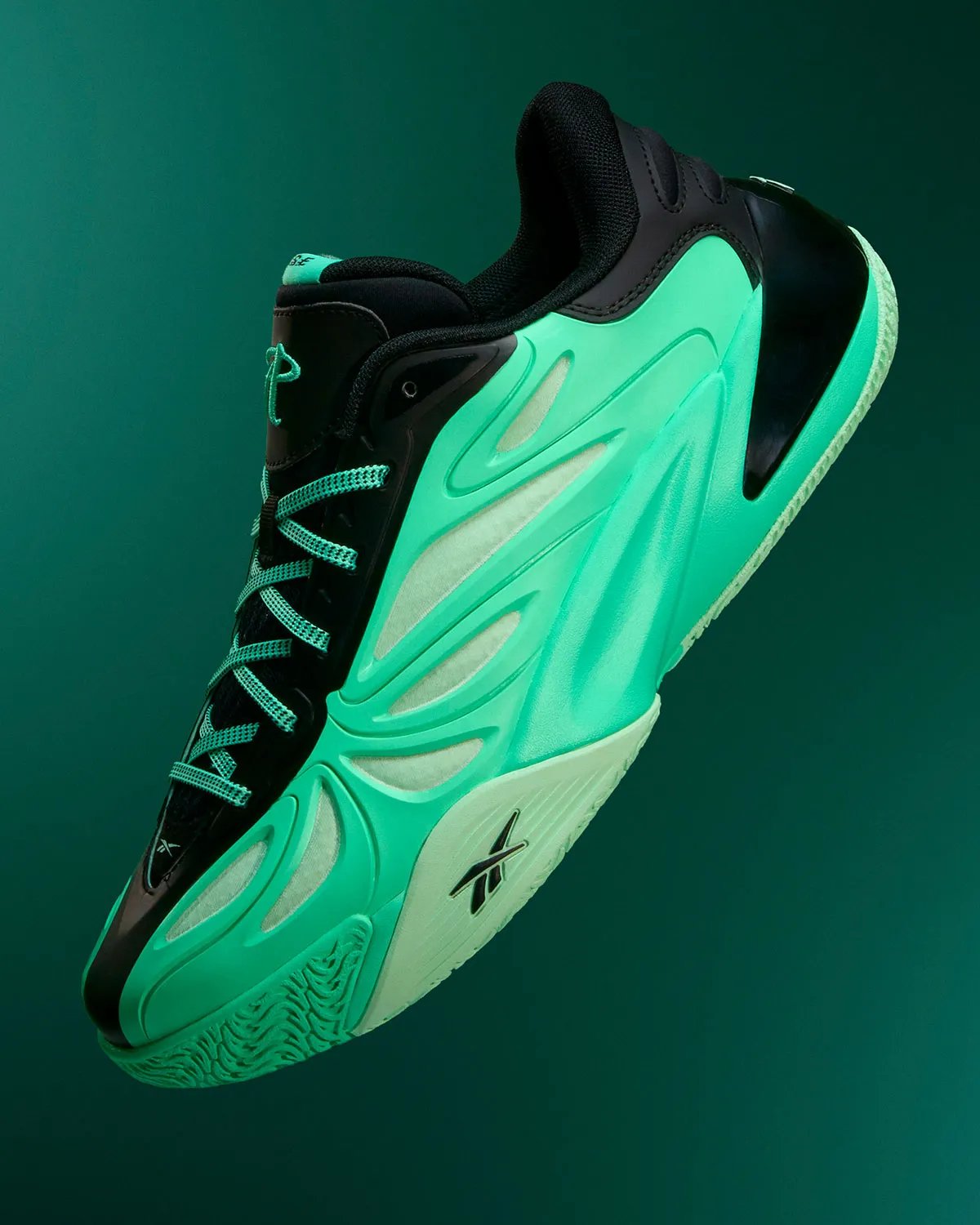 Reebok Angel Reese 1 Metal Green and Aqua colorways displayed side by side, showing muted pastel and vibrant aqua treatments with contrasting heel details - detail view 4